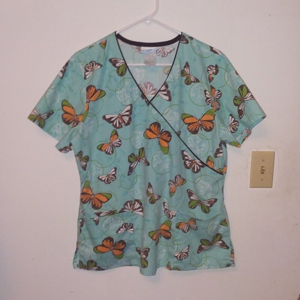 Various floral and animal print scrub tops - all fit medium size